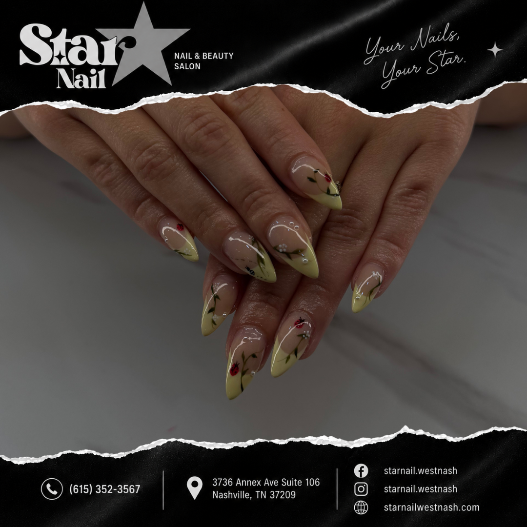 Pastel yellow stiletto nails with hand-painted rosebud floral art at Star Nail in West Nashville, TN